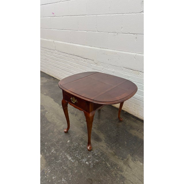 This elegant Stanley Furniture accent table from the American Craftsman Collection is a timeless piece that blends classic...