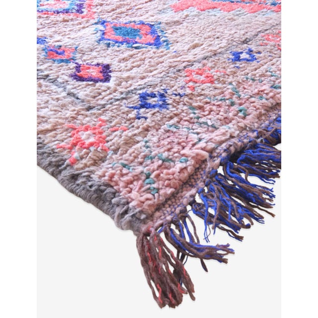 Introduce a touch of Moroccan charm to your home with our Boujad rug, measuring 8.2 x 5.09 ft. Made with traditional...