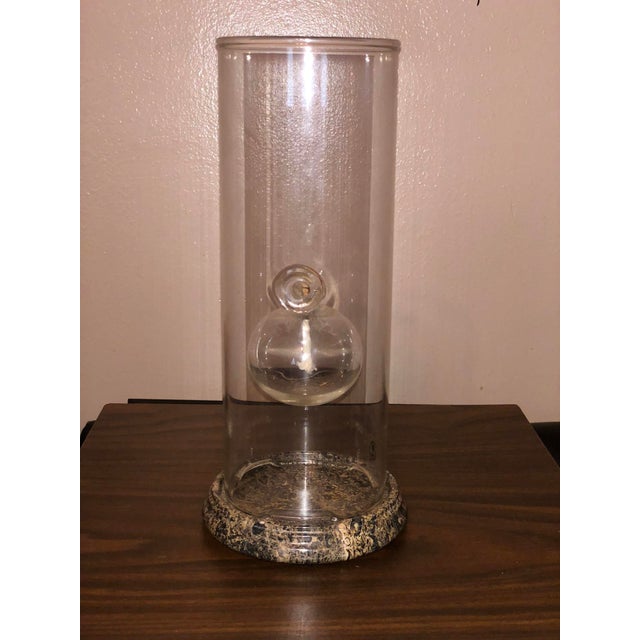 An iconic 12-inch Classic Oil Lamp crafted by the Wolfard Glassblowing Company, complete with a polished multi-tone stone...