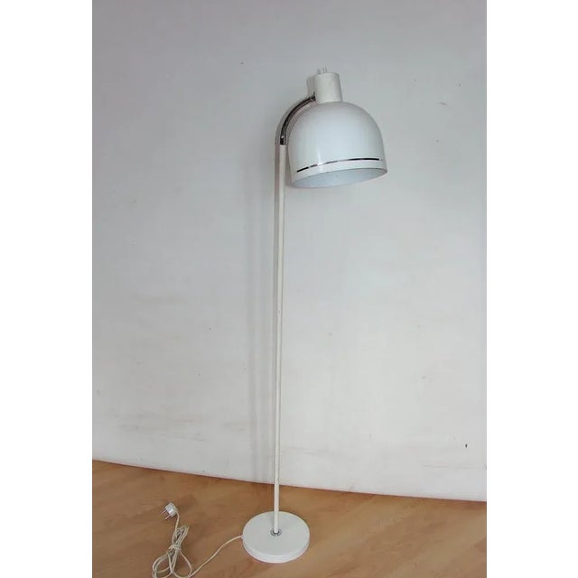 Danish floor lamp, 1970s. It was made of metal, requires an E27 bulb. The lamp is preserved in good condition, has a...