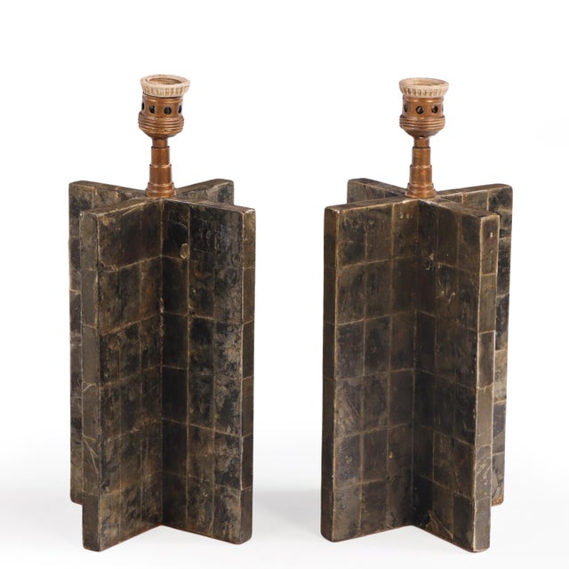 A pair of striking lamp bases of cruciform form, entirely clad in a meticulously arranged patchwork of natural mica...