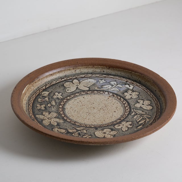 Beautiful floral catch-all plate, by renowned Vermont ceramist David Mischke. Features a lovely brown, tan and periwinkle...