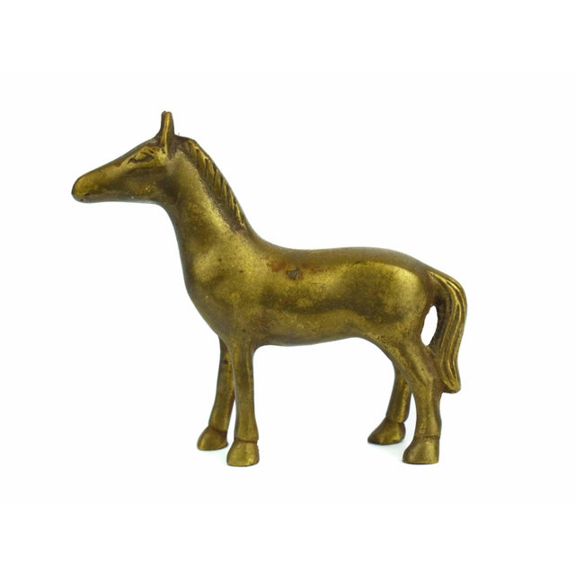 This Solid Gold Brass Horse Pony Figurine is a charming example of vintage Animalia, featuring a stylized silhouette that...