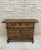 From Northern Spain, constructed of solid walnut, the rectangular top with molded edge atop a conforming case housing two...