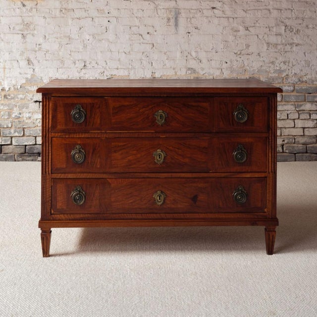 Elevate your collection with this exceptional 18th century French Alsace walnut commode, a beautifully crafted piece that...