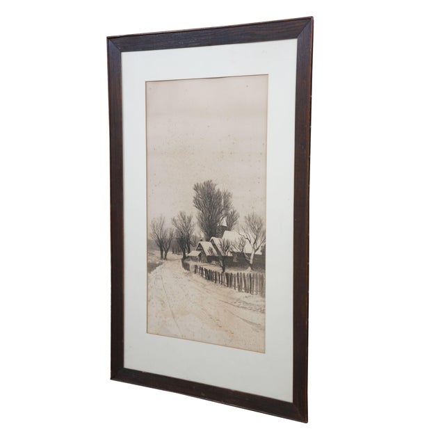 Late 19th century black and white etching by Ernest C. Rost. A vertical landscape showing a snow covered church with spire...