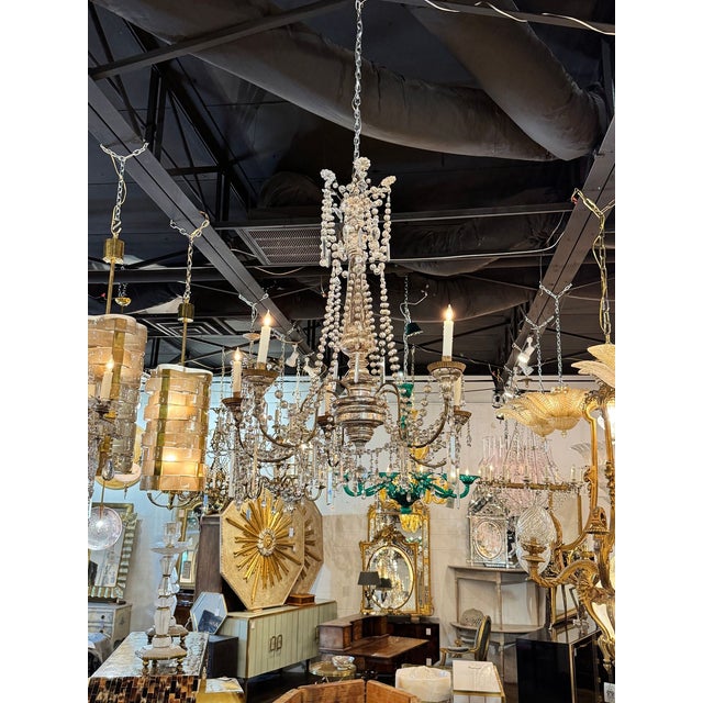 These 19th century Italian Silverleaf wood and crystal chandeliers are a stunning example of architectural lighting...