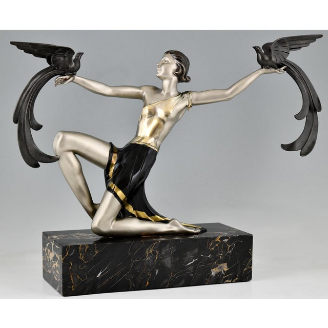 Art deco bronze sculpture of a lady with birds of paradise by g. Daverny, dating from circa 1930 and made in france. this...
