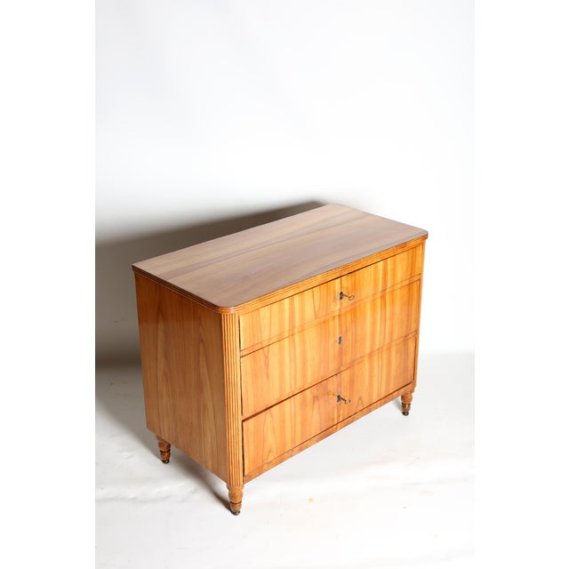 Beautiful cherrywood veneered chest of drawers, 3 drawers with locks, 3 keys included, carefully restored and hand-...