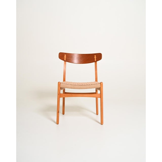 Beech and teak chairs with woven paper cord seats. Designed by hans j. Wegner for carl hansen & søn, 1950s, model “ch23”....