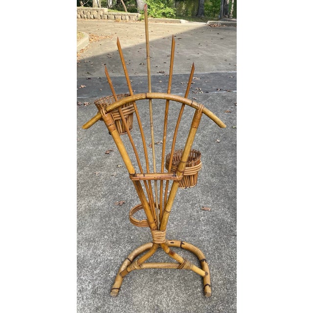 Love this vintage bamboo plant stand! Has a place for three planters and includes two bamboo planters that can be used in...