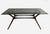 Mid-Century Modern style is beautifully expressed in the clean lines and sleek silhouette of this elegant dining table....