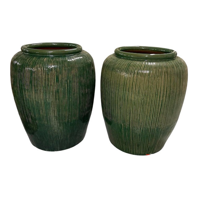 A Pair of Large Mid-Century Modern Ribbed Green Glazed Ceramic Ovoid Planters For Sale