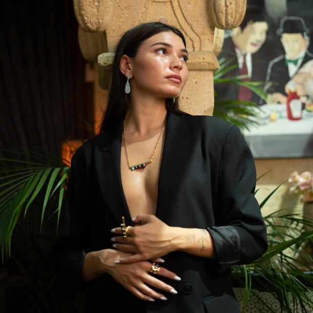 Bring timeless charm to your style with the Vintage Turquoise Teardrop Earrings. Handcrafted from bronze and plated with...