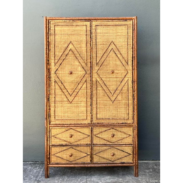 This striking vintage armoire is a masterclass in texture and form, blending Hollywood Regency opulence with refined...
