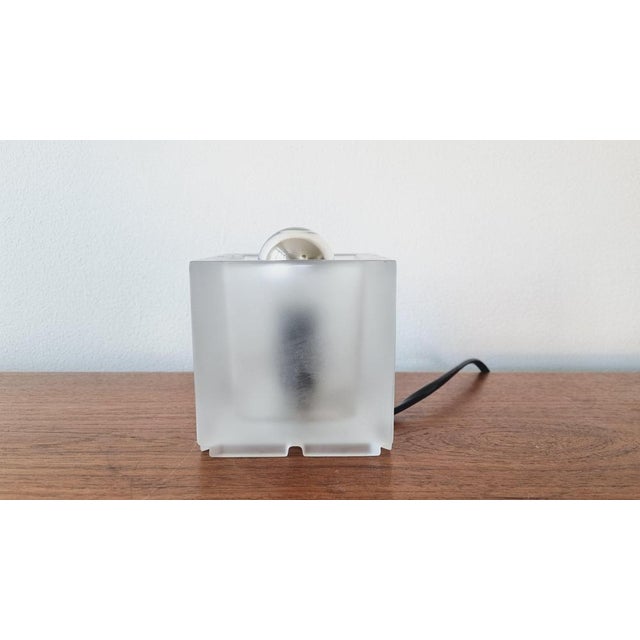 Very nice style of lighting. Wear consistent with age and use. This piece is attributed to the mentioned designer/maker....