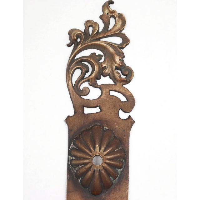 Antique entry bronze door back plate with an Art Nouveau style. The original mounting screws are not available. Good...