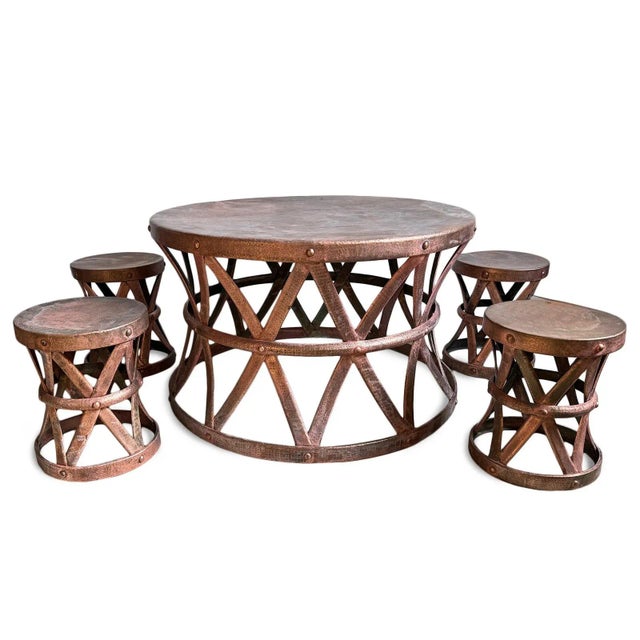 Vintage outdoor copper round table set, including four stools. Hand hammered finish that will agent patina to a beautiful...