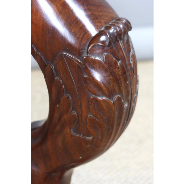 Empire Consulate period pedestal table in solid mahogany carved with lion heads. The three legs, which end in claws, are...