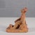 This original vintage figurative sculpture, dated 1953, is a captivating example of mid-century narrative art in...