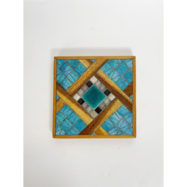 Beautiful handcrafted French trivet from the 1960s combining warm natural wood with vibrant turquoise ceramic tiles and...