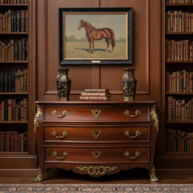 A very handsome pair of antique Chinese gilt papier-mâché featuring finely detailed depictions of figures, pagodas, and...