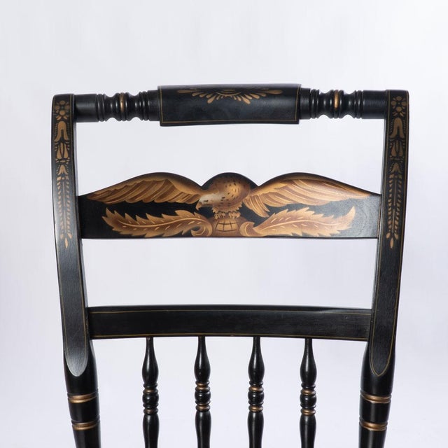 Pair of signed Hitchcock chairs with eagle decorations. Great detail painted and carved onto this piece. Would make a...