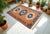 This New Turkish Hand-Knotted Oushak rug is made of wool on wool with orange background. Made 10-20 years ago. It has been...