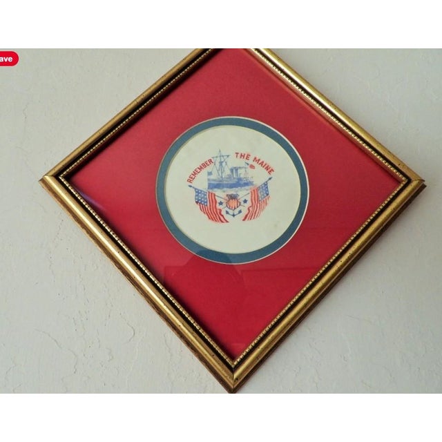 This marvelous hand painted handkerchief is created in gorgeous white linen with red and blue ink and depicts the Maine...