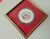 This marvelous hand painted handkerchief is created in gorgeous white linen with red and blue ink and depicts the Maine...