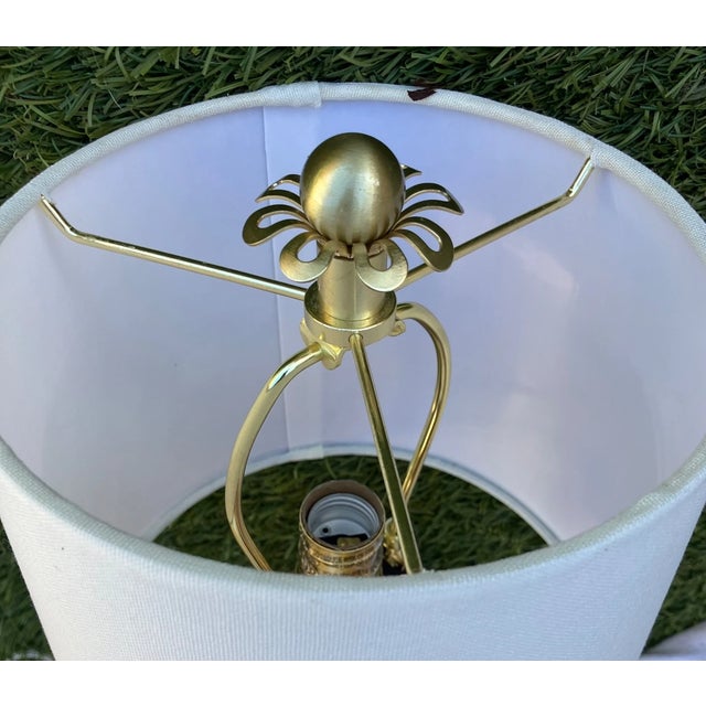 Add a touch of sophistication and femininity to your space with this stunning Kate Spade brass gold table lamp. Designed...