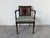 Elegant vintage Hollywood Regency style armchair featuring a beautifully faux grain-painted wood frame with a rich ebony...