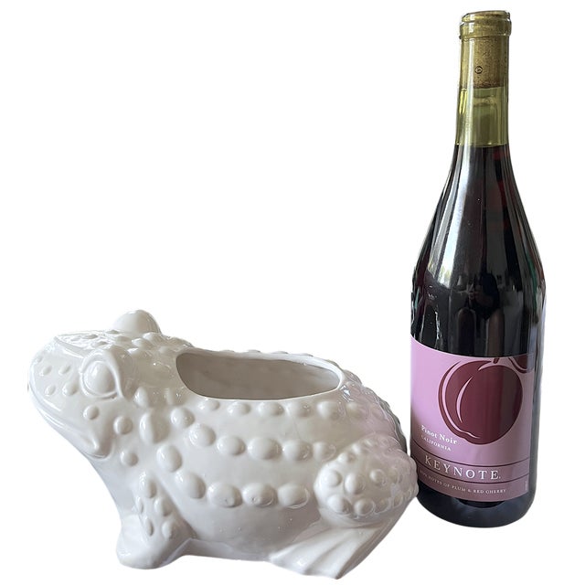 Charming vintage white ceramic frog planter rendered in a sculptural, high-gloss glaze, in the style of Jean Roger. This...
