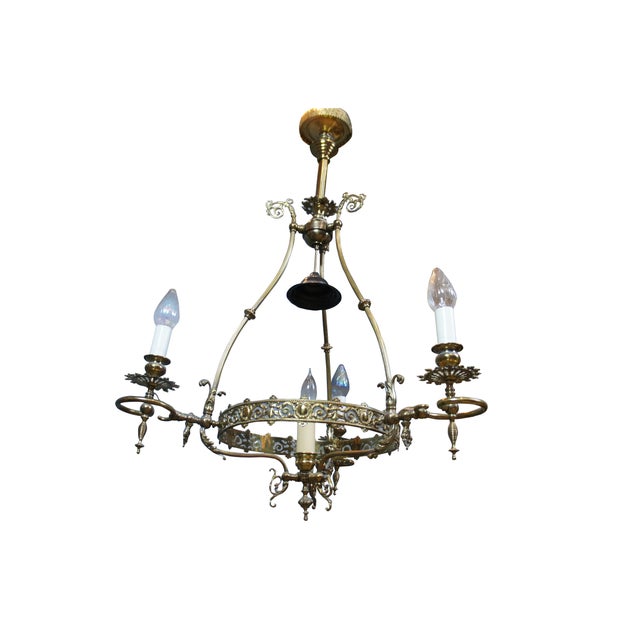 Antique Victorian four light converted oil lamp pendant chandelier. Made of brass featuring French Neoclassical styling...