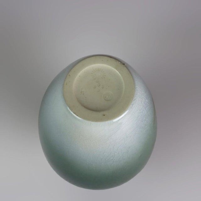 An Arts and Crafts Rookwood Pottery vase, hand-painted by the artist Carl Schmidt, dating to circa 1902. This piece...