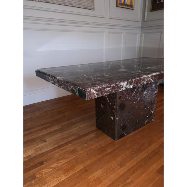 Stunning eggplant color marble table. Has prominent green and white veining. Perfect for any dining room. Purchased at a...