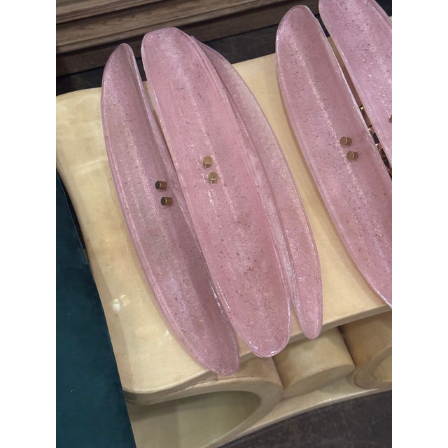 These bespoke sconces are a pair of beautiful Murano pink glass fixtures designed to enhance the ambiance of any room with...