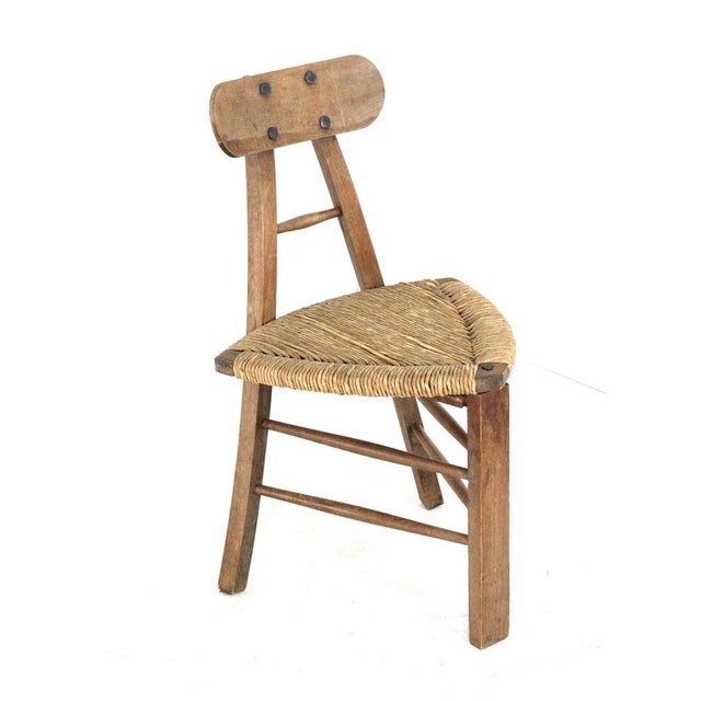 Add a unique and sculptural element to your interior with this distinctive set of two tripod chairs. These three-legged...