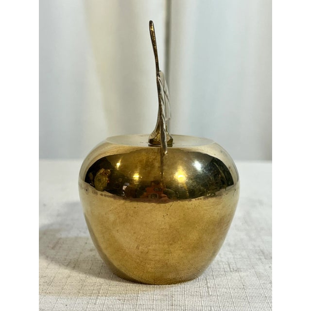 This Vintage Handmade Polished Solid Brass Apple Bell is a charming and unique piece that makes for a thoughtful gift for...
