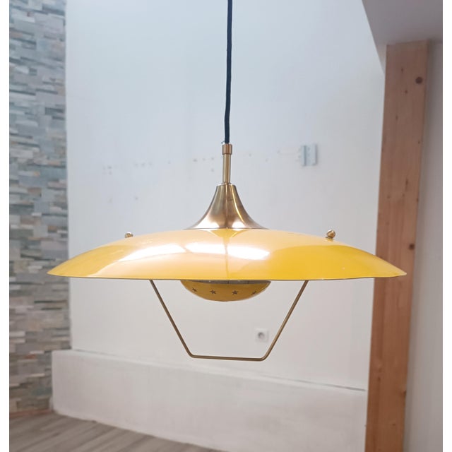Exquisite Saliscendi pendant lamp. Italy, 1960s. A very rare model, post-war modernism. Influences of space age and retro...