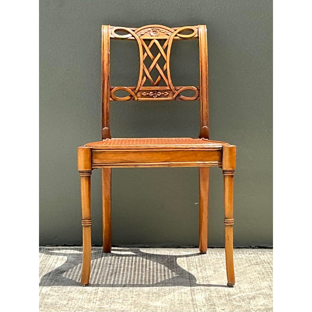 This elegant vintage side chair beautifully blends Neoclassical architectural elements with refined artisan craftsmanship....