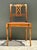 This elegant vintage side chair beautifully blends Neoclassical architectural elements with refined artisan craftsmanship....