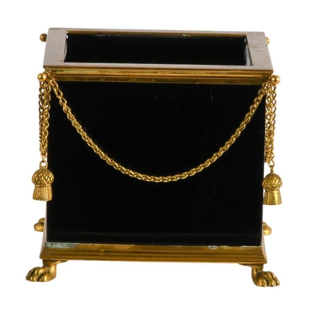 Add timeless sophistication to your interior with this elegant Neoclassical-style cache pot featuring a striking black...