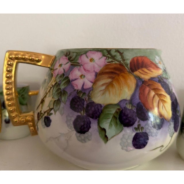 The 6 Piece Antique Limoges Hand Painted Blackberry Pitcher and Cups set is a collectible piece for those with a love for...