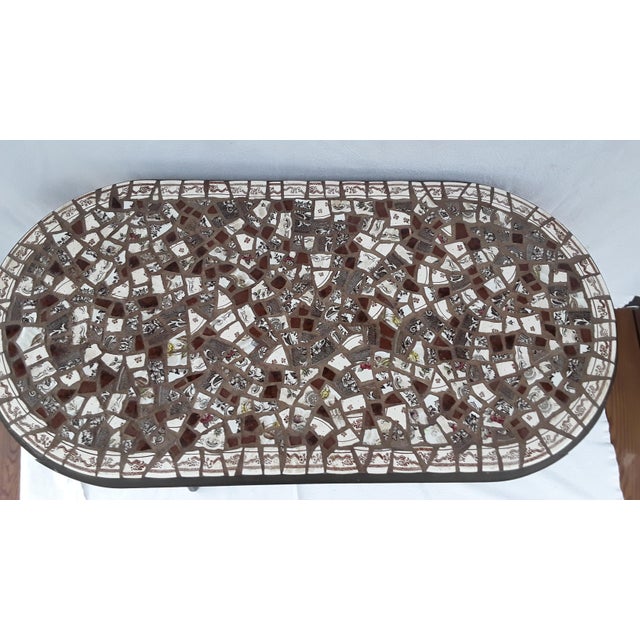 Lovely pique-assiette "plate mosaic" top in shades of chocolate on a painted vintage wicker table. Chocolate paint with...