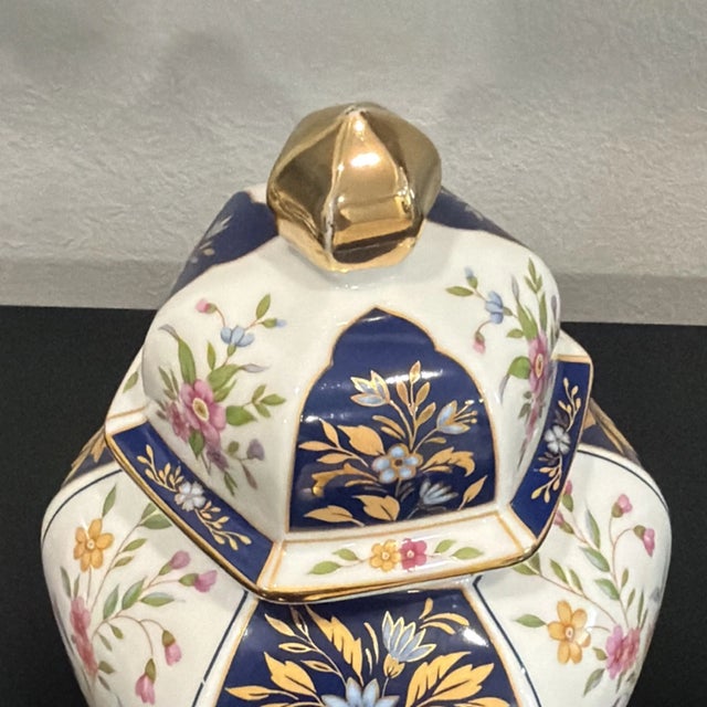 Beautiful vintage Japanese porcelain ginger jar featuring an elegant hexagonal shape and intricate floral decoration. The...