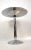 An Art Deco style mirror top and polished chrome pedestal accent table. The concentric layered circles detail on the base,...