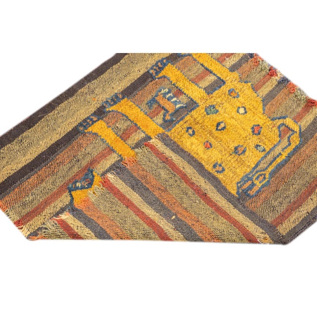 This antique Gabbeh Palas rug, woven circa 1920, is a rare piece of Persian tribal art. It features a flat-woven wool base...