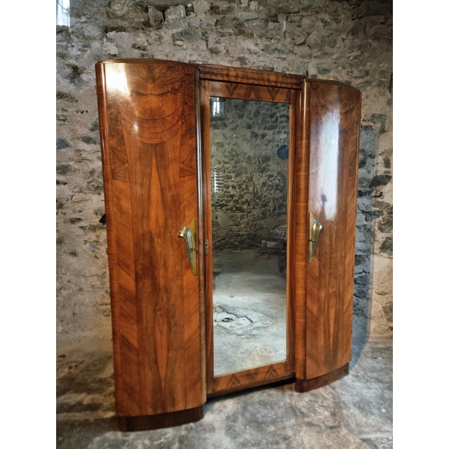 Origin: France Period: 1930s Materials: Walnut veneer on solid wood (bookmatched pattern), possible rosewood and mahogany...