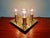 Square brass Space Age ceiling light with four tubular light points, produced by the German manufacturer Cosack Leuchten...